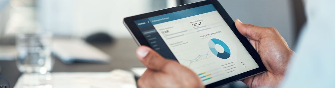 Business man using a digital tablet in a modern office